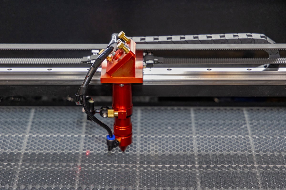 Laser cutting and engraving machine head performing precision CNC work